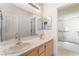 Bright bathroom features a double sink vanity with modern fixtures and a separate tiled shower, offering convenience and style at 1363 Yeager Ave, Las Vegas, NV 89123