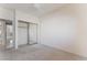 Bedroom with carpet, mirrored closet and neutral paint at 1363 Yeager Ave, Las Vegas, NV 89123