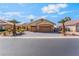 Beautiful home with desert landscaping, a spacious driveway, and a two-car garage at 1363 Yeager Ave, Las Vegas, NV 89123