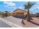 Charming home featuring a spacious driveway, desert landscaping, and a two-car garage at 1363 Yeager Ave, Las Vegas, NV 89123