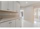 Hallway featuring white cabinetry and marble countertops at 1363 Yeager Ave, Las Vegas, NV 89123