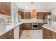 Modern kitchen featuring stainless steel appliances, designer backsplash, and ample counter space at 1363 Yeager Ave, Las Vegas, NV 89123