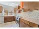 Modern kitchen featuring granite countertops, wood cabinets, and stainless steel appliances at 1363 Yeager Ave, Las Vegas, NV 89123