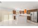 Modern kitchen featuring stainless steel appliances, wood cabinets, and a sliding glass door at 1363 Yeager Ave, Las Vegas, NV 89123