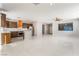 Modern kitchen with stainless steel appliances, bright orange range hood, and ample counter space at 1363 Yeager Ave, Las Vegas, NV 89123