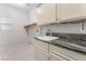 Laundry room features granite counters, sink, and cabinets at 1363 Yeager Ave, Las Vegas, NV 89123