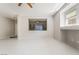 Bright living room with pass-through window to the kitchen and modern light-grey decor at 1363 Yeager Ave, Las Vegas, NV 89123