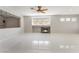 Spacious living room featuring modern tile flooring, a fireplace, and great natural light at 1363 Yeager Ave, Las Vegas, NV 89123