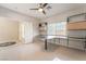 Spacious office area with custom cabinets, work area, and bright natural light at 1363 Yeager Ave, Las Vegas, NV 89123