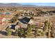 Overhead view of home with detached garage, desert landscaping, and distant mountain views at 170 Story Ave, Pahrump, NV 89060