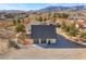 An aerial view of the property highlighting the home's architecture and landscaping at 170 Story Ave, Pahrump, NV 89060
