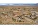 Aerial view of home, outbuildings, and large desert property with distant mountain views at 170 Story Ave, Pahrump, NV 89060
