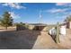 Backyard featuring a shade structure, privacy fence, propane tank, and gravel surface at 170 Story Ave, Pahrump, NV 89060