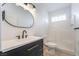 Modern bathroom features a sleek vanity, tiled shower, and ample lighting at 170 Story Ave, Pahrump, NV 89060