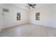 Well-lit bedroom showcasing wood floors and bright windows at 170 Story Ave, Pahrump, NV 89060