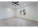 Bright, airy bedroom with hardwood floors, ceiling fan and two windows allowing ample natural light at 170 Story Ave, Pahrump, NV 89060