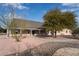 Inviting ranch home with a stone pathway, manicured landscaping, and covered porch at 170 Story Ave, Pahrump, NV 89060