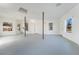 Expansive garage with multiple windows, white walls, and a concrete floor at 170 Story Ave, Pahrump, NV 89060
