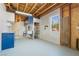 Spacious garage area with white walls, built-in cabinets and shelving, a utility sink and a window at 170 Story Ave, Pahrump, NV 89060
