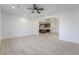 Open-concept living room showcasing hardwood floors and an archway leading to the kitchen at 170 Story Ave, Pahrump, NV 89060