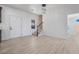 Bright, open living room with new floors, staircase and elegant lighting at 170 Story Ave, Pahrump, NV 89060