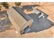 Aerial view of barn featuring large roll-up doors, shingled roof, and lean-to area at 170 Story Ave, Pahrump, NV 89060