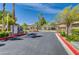 Gated community entrance with lush landscaping and decorative stone accents offers privacy and curb appeal at 1713 Queen Victoria St # 104, Las Vegas, NV 89144