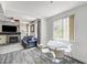 Cozy dining area featuring a modern table set near a window, with a view to the living room at 1713 Queen Victoria St # 104, Las Vegas, NV 89144
