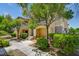 Charming two-story home with lush landscaping, providing a welcoming atmosphere and curb appeal at 1713 Queen Victoria St # 104, Las Vegas, NV 89144