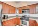 Modern kitchen with stainless steel appliances and ample counter space at 1713 Queen Victoria St # 104, Las Vegas, NV 89144