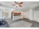 Open-concept living space showcasing wood-look flooring and seamless flow to the kitchen at 1713 Queen Victoria St # 104, Las Vegas, NV 89144