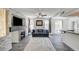 Bright living room with a decorative fireplace, ceiling fan, and wood-look flooring at 1713 Queen Victoria St # 104, Las Vegas, NV 89144