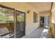 Outdoor patio features sliding glass door and a view of nature at 1713 Queen Victoria St # 104, Las Vegas, NV 89144