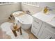 Modern bathroom featuring soaking tub with accessories and single vanity at 2264 Savannah River St, Henderson, NV 89044