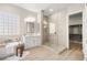 Modern bathroom showcasing glass enclosed shower, large tub, single vanity and neutral tones at 2264 Savannah River St, Henderson, NV 89044