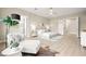Spacious bedroom with ensuite bathroom, sitting area, and stylish decor at 2264 Savannah River St, Henderson, NV 89044