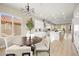 Open concept kitchen and dining area with light hardwood floors and modern light fixtures at 2264 Savannah River St, Henderson, NV 89044