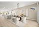 Modern dining area features stylish lighting, seating for six, and an open floor plan to the kitchen at 2264 Savannah River St, Henderson, NV 89044