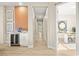 Hallway view with modern decor, wet bar, and access to rooms with stylish interiors at 2264 Savannah River St, Henderson, NV 89044