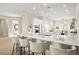 Beautiful kitchen with stone countertops, stainless appliances, and an island with seating, open to living spaces at 2264 Savannah River St, Henderson, NV 89044