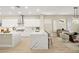 Modern, bright kitchen featuring stone countertops, stainless steel appliances, and seamless living area access at 2264 Savannah River St, Henderson, NV 89044