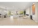 Expansive living area with stylish furnishings, fireplace, wet bar, and light-filled dining space, perfect for entertaining at 2264 Savannah River St, Henderson, NV 89044