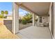 Inviting covered patio with gravel landscaping and modern furniture, perfect for outdoor relaxation at 2264 Savannah River St, Henderson, NV 89044