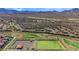 Aerial view of a neighborhood with mountain views and desert landscape at 244 Native Stone St, Las Vegas, NV 89138