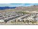 An aerial view of a vibrant neighborhood with mountain views at 244 Native Stone St, Las Vegas, NV 89138