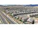 Aerial view of a Primary planned community with pools and well landscaped exteriors at 244 Native Stone St, Las Vegas, NV 89138