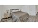 Bedroom with a double bed, wood-look flooring, a nightstand and a closet with sliding doors at 244 Native Stone St, Las Vegas, NV 89138