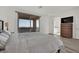 Bedroom showcasing a balcony with neighborhood views and wood-look floors at 244 Native Stone St, Las Vegas, NV 89138
