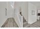 Bright entryway featuring high ceilings, wood-look floors, a modern staircase, and plenty of natural light at 244 Native Stone St, Las Vegas, NV 89138
