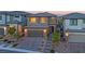 Beautiful two-story home featuring a paved driveway, desert landscaping, and a welcoming facade at 244 Native Stone St, Las Vegas, NV 89138